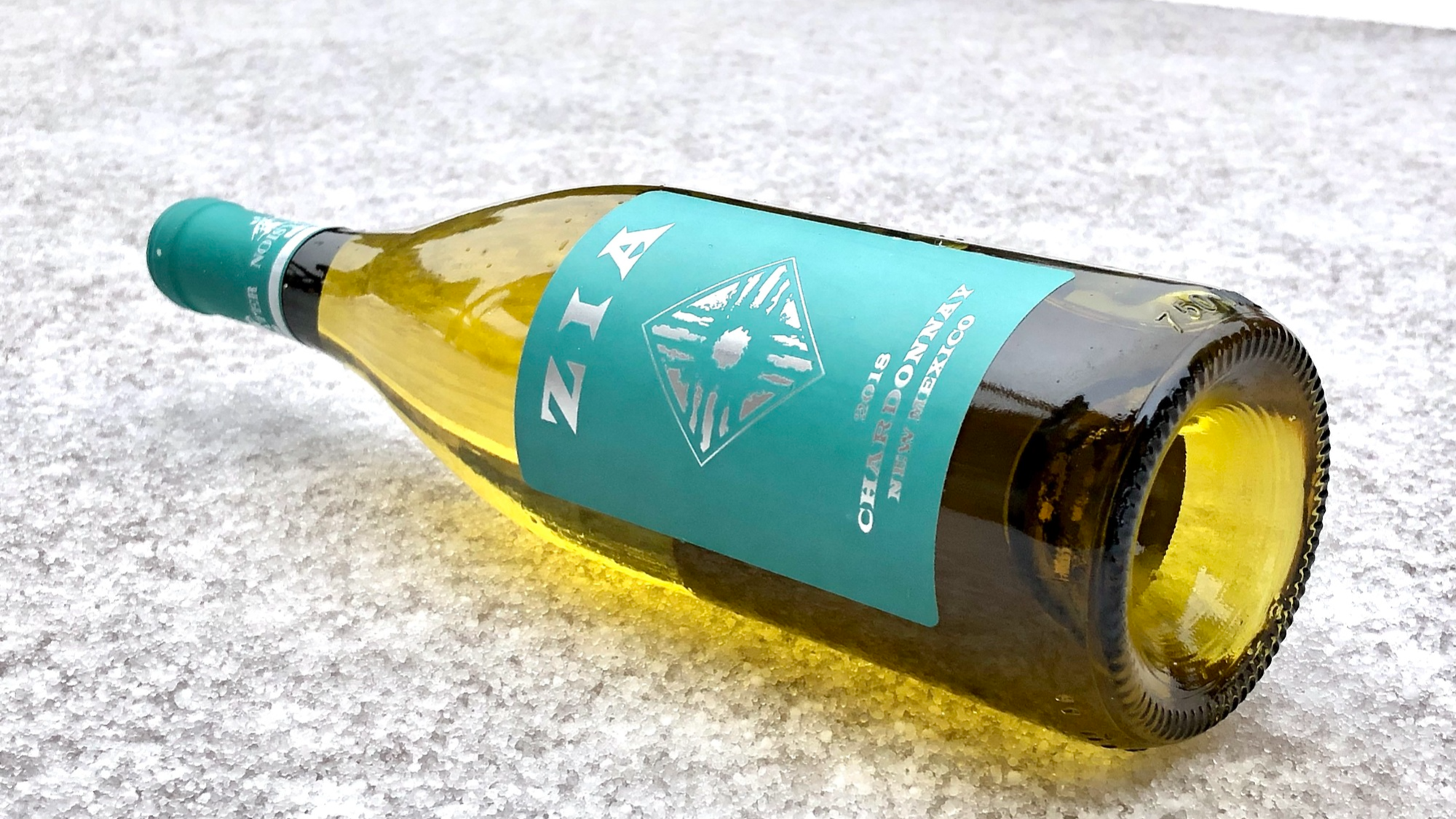 Noisy Water Winery's 2018 Zia Chardonnay on a bed of snow